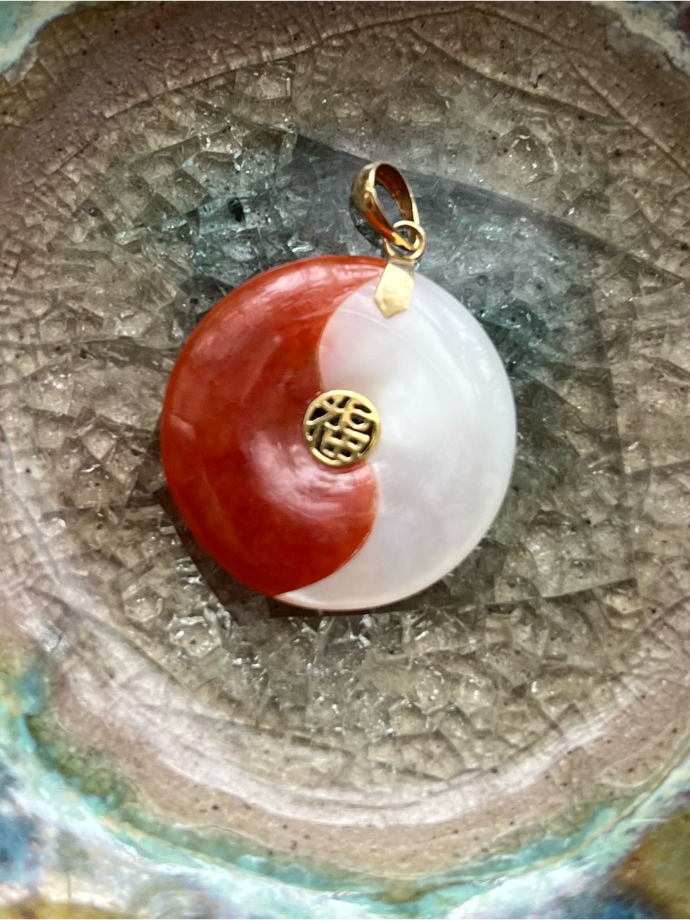 Red and White Yin Yang jadeite/mother of pearl Pendant.  Gold accents and bail .